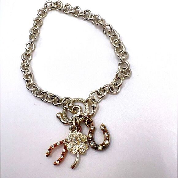 *3/$20* Silver tone toggle bracelet with horseshoe clover and wishbone charms - Picture 1 of 3
